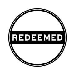 Black color round seal sticker in word redeemed on white background