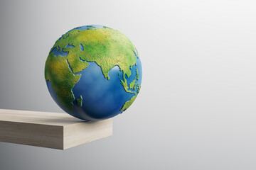 Abstract image of globe on edge of wooden block trampoline and mock up place on gray background. 3D Rendering.