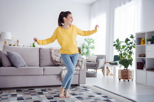 Photo of cheerful carefree energetic lady enjoy party disco weekend wear yellow pullover comfortable home indoors