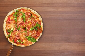 Tasty classic pizza on hot pan