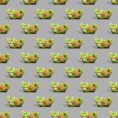 Fresh vegetables in a metal shopping cart. Seamless pattern of shopping baskets isolated on gray background.