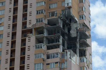 War in Ukraine. Destroyed building in Kyiv after russian missile attack. Consequences of russian invasion in Ukraine. 