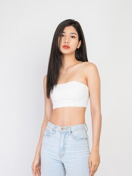 Portrait of a beautiful sexy young asian female long hair lady in white color tube top fashion, good for cosmetic and skincare or barber ads