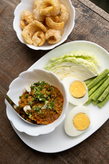 Thai minced pork chili paste with boiled egg and fresh vegetables