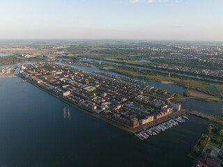 Fototapeta premium Amsterdam Ijburg artificial island modern residential area smart city cityscape at water Ijmeer. Urban houses buildings city environment area.