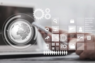 Intelligence and business analytics concept. Man designer working on laptop computer