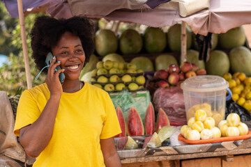 lady in a market making a phone call