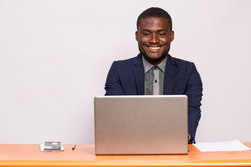 portrait of an african businessman smiling while working