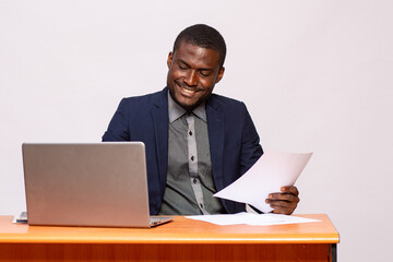 african businessman smiling while working
