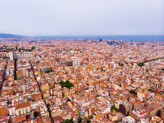 Fototapeta premium mass of roofs of houses on the spanish city of Barcelona