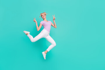 Fototapeta na wymiar Full length body size view of attractive trendy girl jumping showing v-sign good mood isolated over teal turquoise color background