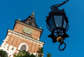 Fototapeta na wymiar Town Hall Tower, KrakowStreet Light and Town Hall Tower, Main Square, Rynek Glowny, Krakow, Poland