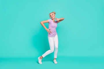 Fototapeta na wymiar Full length body size view of attractive cheerful carefree girl dancing good mood isolated on teal turquoise color background