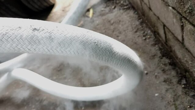 the process of transferring liquid oxygen from a delivery truck to a reservoir in a hospital causes the pipes to freeze and form ice and ice vapor with very cold temperatures