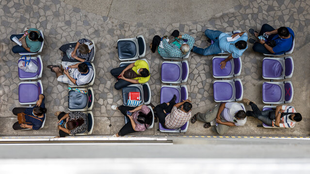 A View From Above, Many People Sitting And Sleeping Queuing For Medicines.