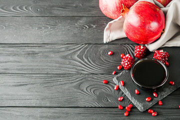 fresh pomegranate sauce narsharab on a black wooden rustic background