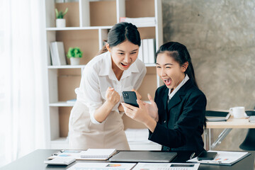 Asian businesswoman shaking hands to congratulate success.