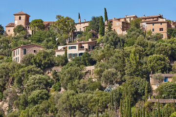 Traditional stone houses and tramuntana mountain range in Deia. Balearic