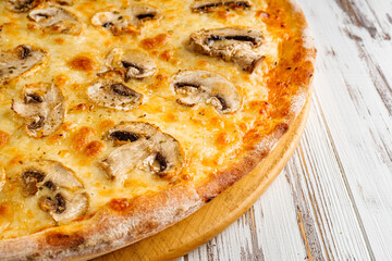 delicious hot traditional italian pizza on a white wooden rustic background