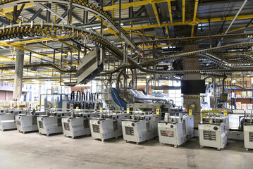 modern machines for transportation in a large print shop for production of newspapers & magazines