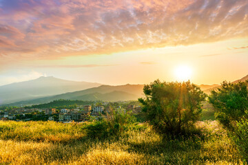 Obraz premium picturesque highland landscape with amazing view from hill with golden grass and green bushes