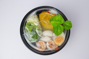 Food rice noodles with crab curry sauce on white background.