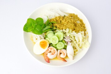 Food rice noodles with crab curry sauce on white dish on white background.