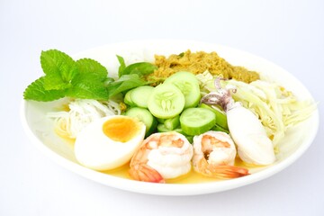 Food rice noodles with crab curry sauce on white dish on white background.