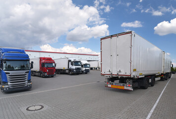 Trucks loading at a depot of a forwarding agency - Transport and logistics in goods trade