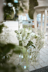 Close up of wedding decorations, with white fresh flowers. Tender wedding arrangements.