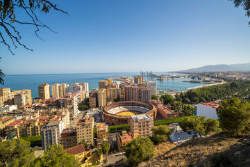 Landscape view of Malaga, Spain. Sea side, industrial port and bull place