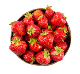 Red strawberry in a wooden plate. Top view