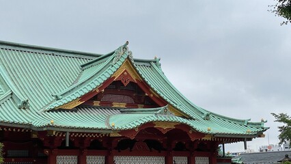 Fototapeta na wymiar The grand pagoda architecture of “Kanda Myojin” and the cloudy rainy seasonal Tokyo sky, year 2022 June 15th 