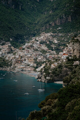 Panoramic views of Positano in the Amalfi Coast in Italy. The view of Positano town, colorful buildings, roads, boats and the sea.