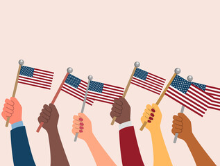 Multi racial hands holding the flag of USA