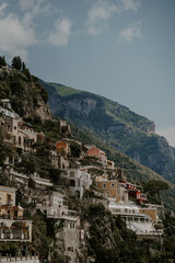 Panoramic views of Positano in the Amalfi Coast in Italy. The view of Positano town, colorful buildings, roads, boats and the sea.