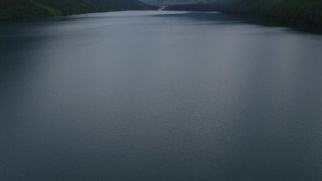 Multin lakes in the middle of mountains in Altai, Siberia, Russia. Beautiful summer nature landscape at pre storm daytime. Aerial view from a drone