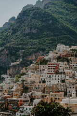 Naklejka premium Panoramic views of Positano in the Amalfi Coast in Italy. The view of Positano town, colorful buildings, roads, boats and the sea.