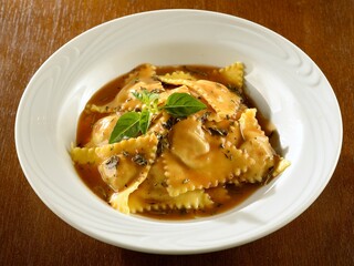 Beef ravioli with herb sauce
