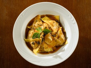 Beef ravioli with herb sauce