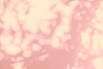 Shadow and light of leaves tree branch background. Natural  colorful leaf pastel pink, coral, rose gold shadow and light from sunlight on wall, shadow overlay effect