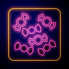 Glowing neon Candy icon isolated on black background. Merry Christmas and Happy New Year. Vector