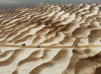Huge sandbars arise in river Jamuna when the water level drops during the dry season. The striking pattern and textures look like desert when seen from above. Aerial sandbar view. Beauty of Nature.
