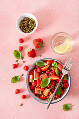 watermelon salad with strawberry raspberry basil seeds. healthy summer dessert
