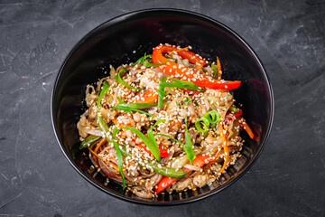 delicious chinese fried noodles on a black background