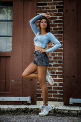 Outdoors portrait near brick wall