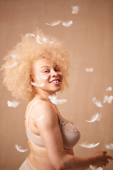Feathers Falling On Confident Natural Albino Woman In Underwear Promoting Body Positivity