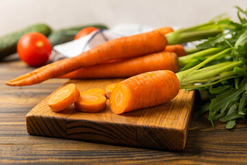 Carrot slices.Fresh carrots on brown texture background. Sliced carrot slices for salad.Vegetarian organic vegetables.Healthy food.Copy space.Place for text