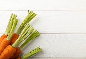 Fresh carrots on a white texture background. Ingredient for salad.Vegetarian organic vegetables.Healthy food.Copy space.Place for text