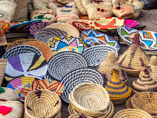 Colorful baskets, some shaped like tajines, for sale in the Marrakech Medina.